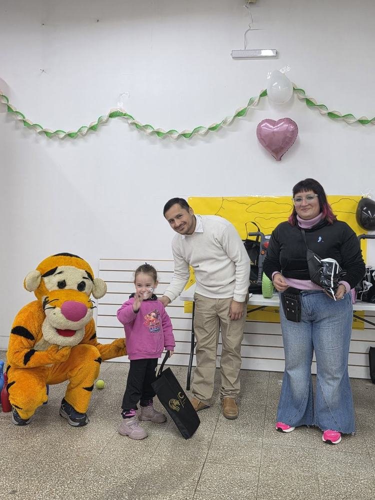 Niña con mascota en evento ITAC